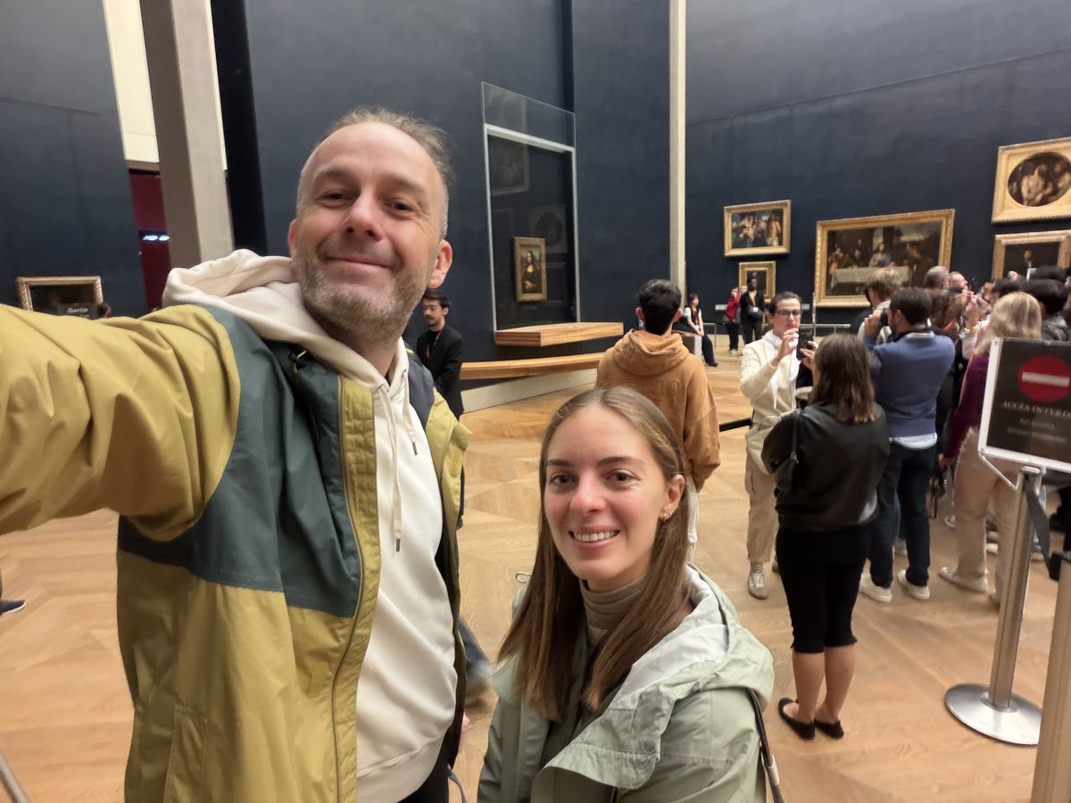 Artur and Jana Jakucewicz with the Mona Lisa at the Louvre at 9:23 AM