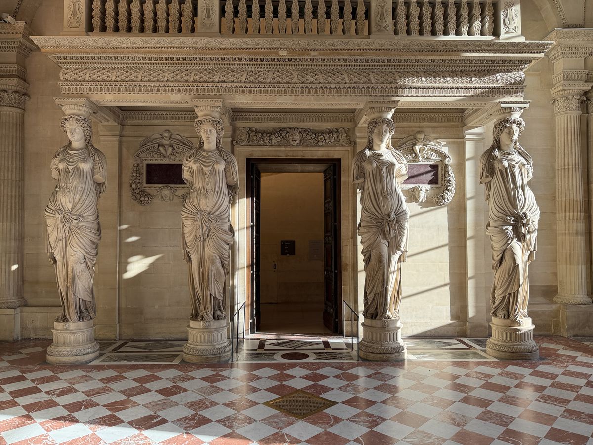 The four caryatids by Jean Goujon in the empty Salle des Caryatides at the Louvre